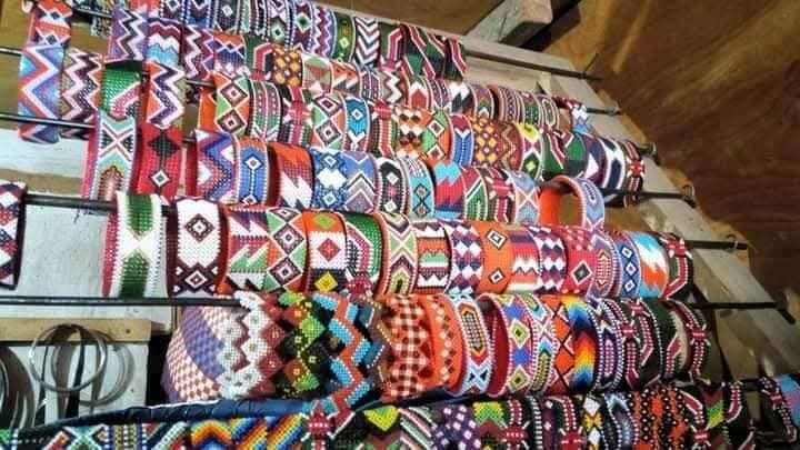 Rows of colourful handmade Maasai beaded belts on display